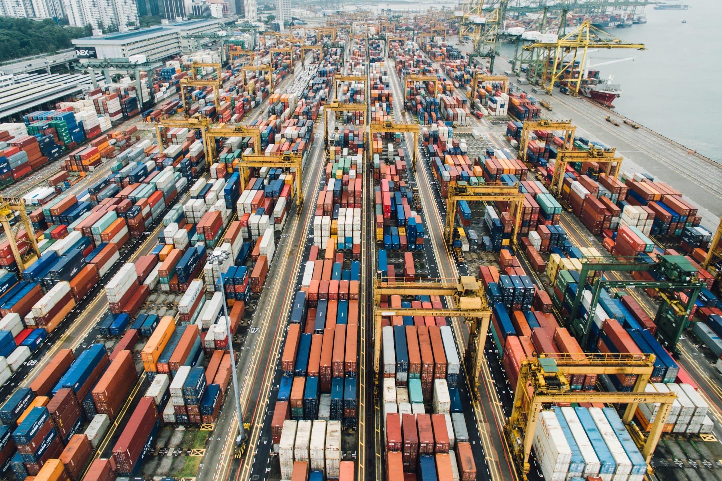 Aerial view of a logistics yard with trucks at sunset